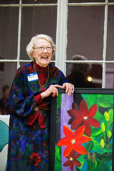 Mary Lou Reed reacts to a story after being presented with a painting during a gathering to celebrate her 20 years of service on the Friends of Head Start board Thursday at The Harding Center in Coeur d���Alene. (Shawn Gust/press)