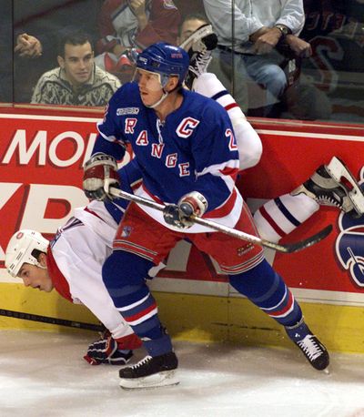 In this 1999 photo, Brian Leetch upends Canadiens’ Matt Higgins.  (Associated Press / The Spokesman-Review)