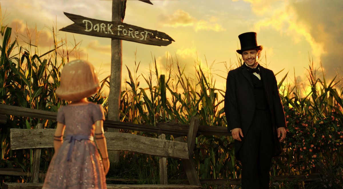The character China Girl, left, voiced by Joey King, and James Franco, as Oz, in a scene from “Oz the Great and Powerful.”