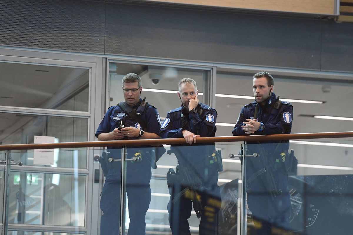 Armed Finnish policemen on guard at the Helsinki airport on Friday, Aug. 18, 2017, as Finnish authorities announced they will raise readiness levels after an incident in Turku Finland. Police in Finland say they have shot a man in the leg after he was suspected of stabbing several people in the western city of Turku. (Vesa Moilanen / Lehtikuva via Associated Press)