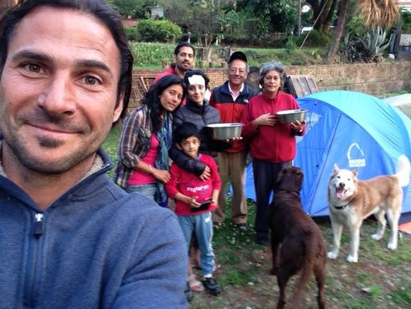 Hazen Audel of Spokane, left, is with a family in Nepal -- camping out to avoid danger of collapsing buildings during a series of earthquakes that have rocked the nation in late April 2015. (Courtesy)