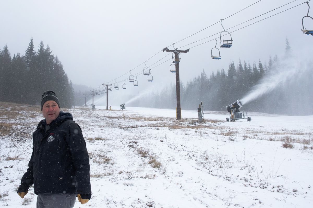 Eric Bakken, general manager of 49 Degrees North, walks beside the resort’s snowmaking machines on Nov. 18, 2021.  (Eli Francovich/The Spokesman-Review)