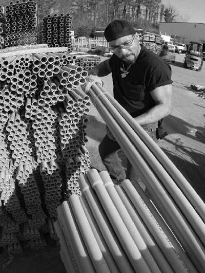 
Parrish Hurst prepares an order of electrical conduit at Home Depot Supply on Monday, Feb. 12, 2007. 
 (Associated Press / The Spokesman-Review)