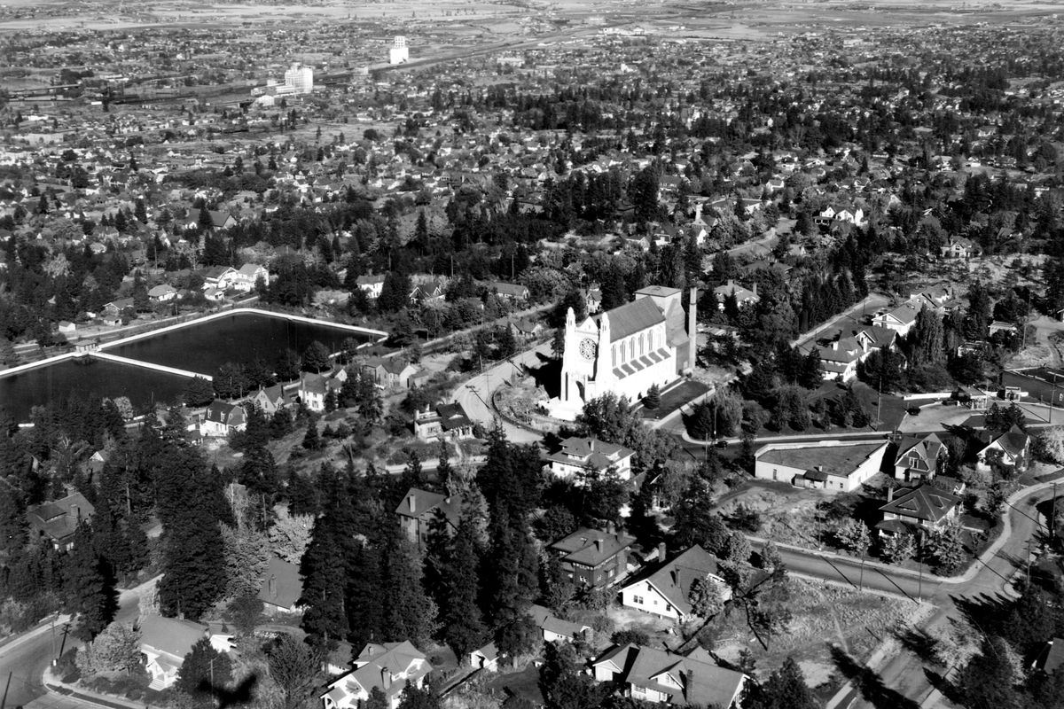 1932: An aerial view shows part of the south side of Spokane. The most prominent structure in the image is St. John’s Episcopal Cathedral. The site of the cathedral was dedicated in 1925 and consecrated in October 1929. (Photo Archive)