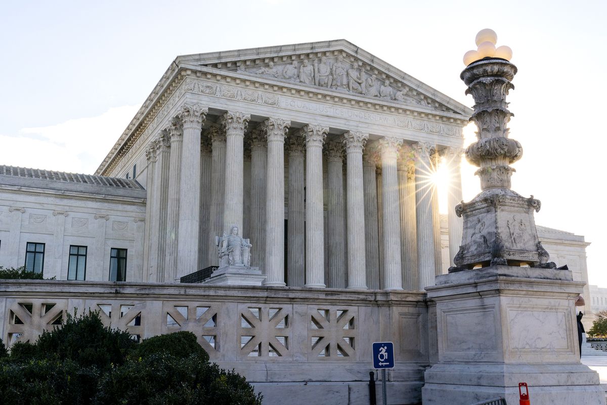 FILE - In this Nov. 10, 2020, file photo the sun rises behind the U.S. Supreme Court in Washington. (Alex Brandon)