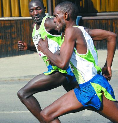 Eventual winner John Korir of Kenya pushes past countryman Julius Kibet in the final stretch at Bloomsday.
(Holly Pickett / The Spokesman-Review)