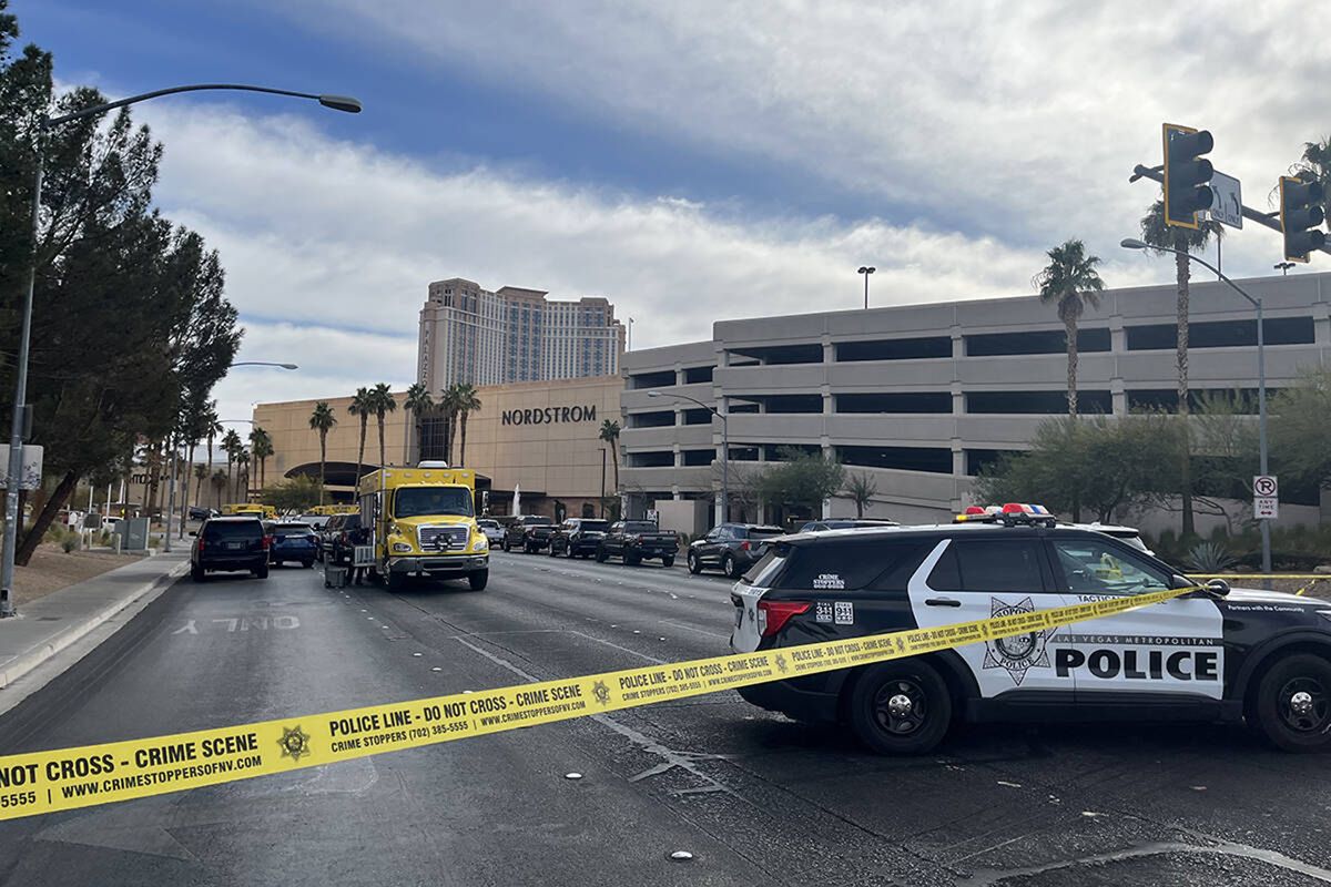 Police enforce road closures at Desert Inn Road and Sammy Davis Jr. Drive after a vehicle fire and explosion Wednesday, Jan. 1, 2025, in front of the entrance to Trump Inrternational Hotel in Las Vegas.  (Noble Brigham/Las Vegas Review-Journal/TNS)