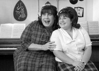 
In this photo released by New Line Cinema, actor John Travolta, left, in character as Edna Turnblad and actress Nikki Blonsky as Tracy Turnblad appear in this scene from the new film 
