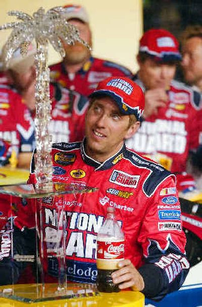 
Greg Biffle celebrates in Victory Lane after winning the Dodge Charger 500 race at Darlington Speedway.
 (Associated Press / The Spokesman-Review)