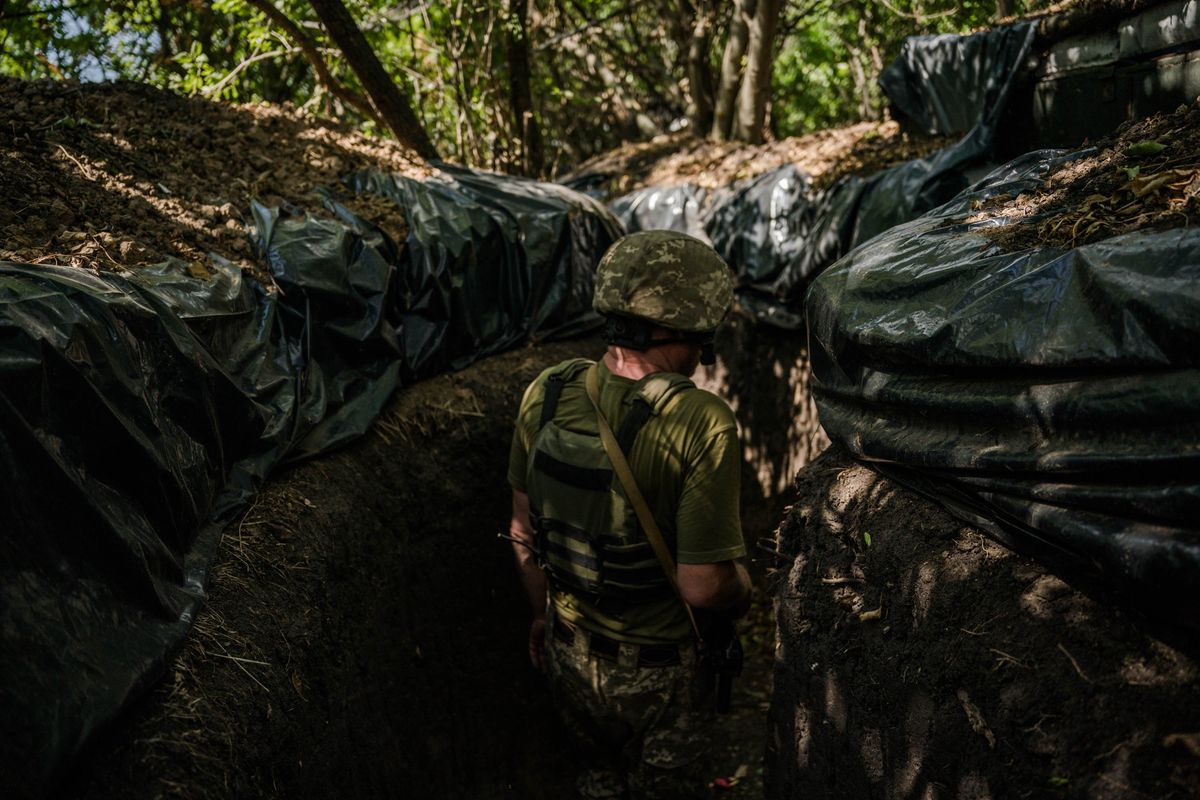 A soldier, call sign Petrovich, stands in a trench on the Kherson frontline on August 8. Efforts by Ukrainian forces to recapture seized territory have slowed. (Wojciech Grzedzinski/For The Washington Post)