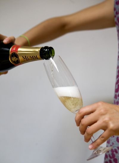 French scientists say pouring Champagne on a slant best preserves the bubbles. (Associated Press)