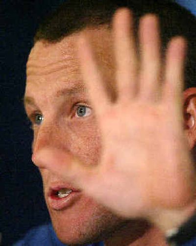
American cyclist Lance Armstrong, a six-time Tour de France winner, gestures as he announces at a news conference in Augusta, Ga., Monday that he will retire from the sport after this year's Tour de France.  
 (Associated Press / The Spokesman-Review)