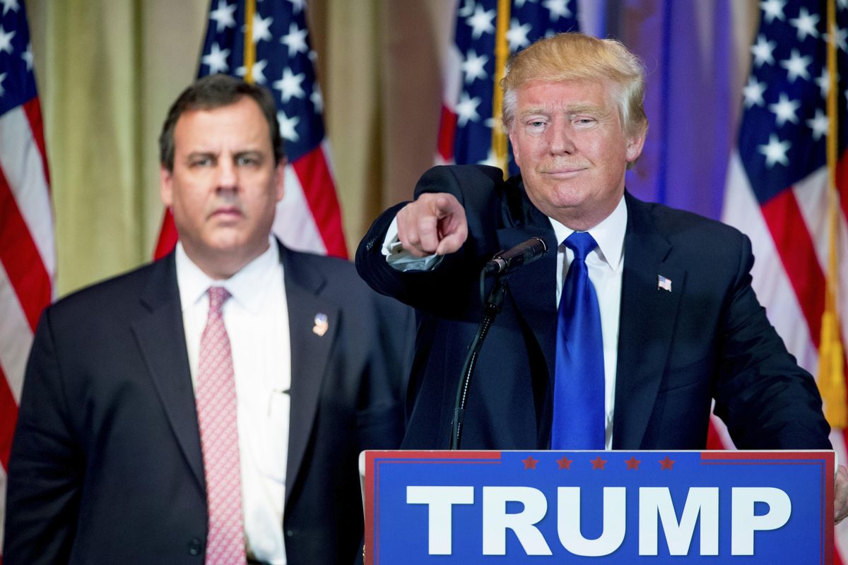 Republican presidential candidate Donald Trump, accompanied by New Jersey Gov. Chris Christie, left, takes questions from members of the media during a news conference on Super Tuesday primary election night in the White and Gold Ballroom at The Mar-A-Lago Club in Palm Beach, Fla., Tuesday, March 1, 2016. (Andrew Harnik / Associated Press)