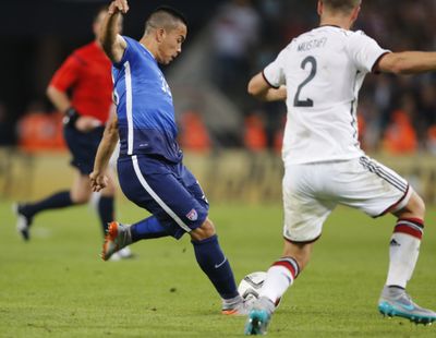 United States forward Bobby Wood launches winning shot in the 87th minute against Germany. (Associated Press)