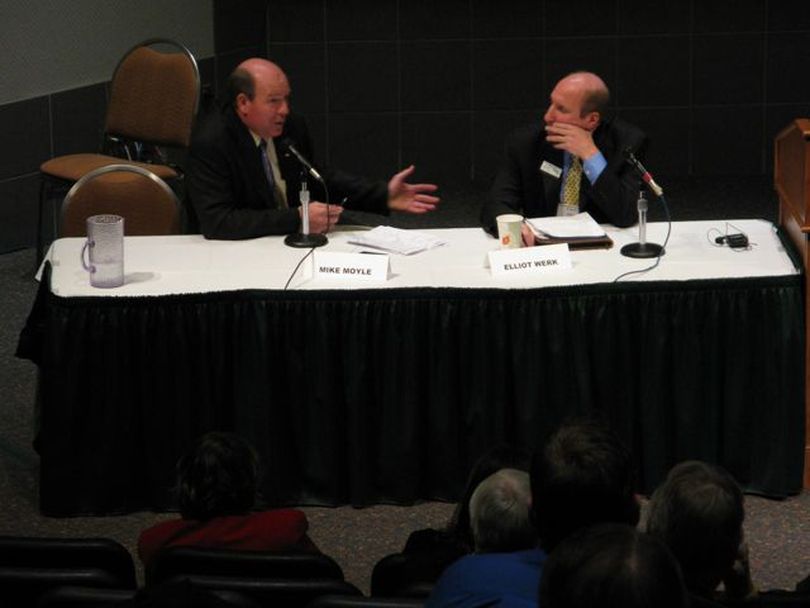 Rep. Mike Moyle, R-Star, left, and Sen. Elliot Werk, D-Boise, right, discuss the state's budget challenges during the Associated Taxpayers of Idaho annual conference on Wednesday. (Betsy Russell)