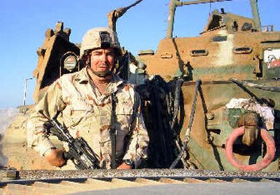 
Dan Ryan, a division fire chief from Post Falls, is seen in a snapshot from Iraq, where he served with the Idaho National Guard in Kirkuk. 
 (Photo courtesy of Dan Ryan / The Spokesman-Review)