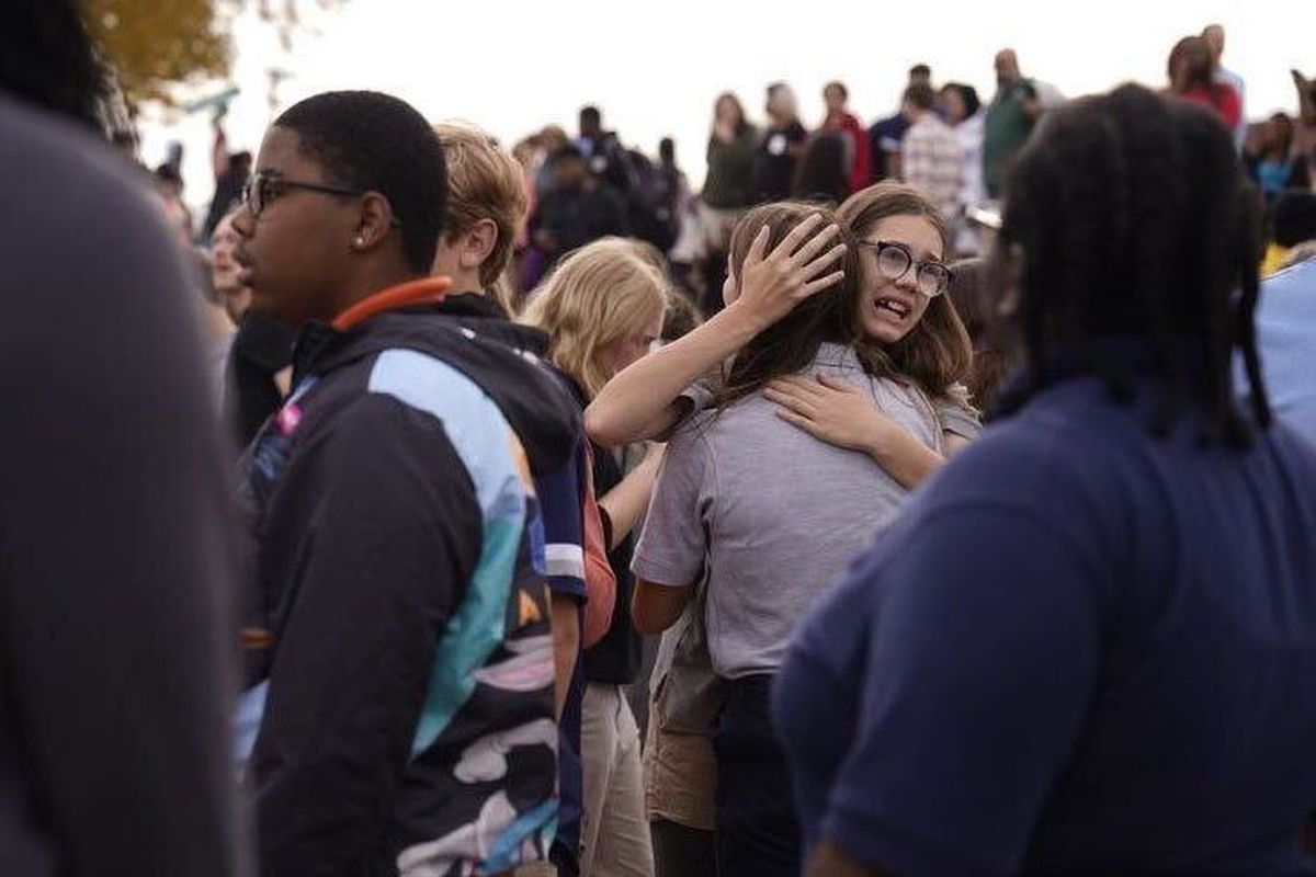 People gather in a safe area after a shooting at Central Visual and Performing Arts high school in St. Louis after a reported shooting at the school in in south St. Louis on Monday, Oct. 24, 2022. (Jordan Opp/St. Louis Dispatch/TNS)