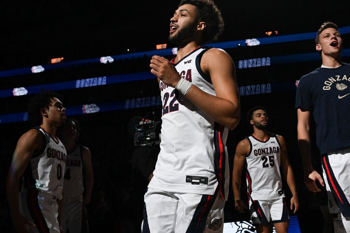 Gonzaga Bulldogs forward Anton Watson (22) cheers with teammates before facing the Connecticut Huskies during the first half of of a college basketball game on Friday, Dec. 15, 2023, at Climate Pledge Arena in Seattle, Wash.  (Tyler Tjomsland / The Spokesman-Review)