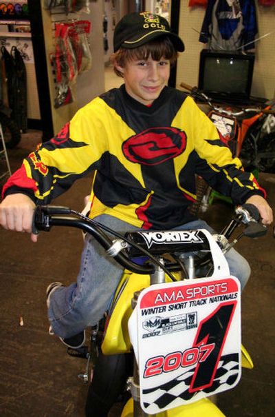 
Wyatt Anderson, 11, shows off the championship number and his new motorcycle following his return from Florida, where he won the Winter National Short Track series championship. Anderson is a fifth-grader at Colbert Elementary School. 
 (Photo Courtesy of PAUL DELANEY / The Spokesman-Review)
