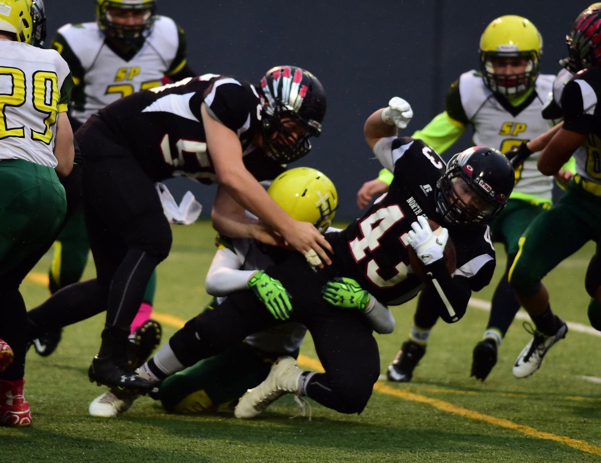 North Central tailback Kieran McHenry (43) runs the ball during the first half of a GSL high school football game at Joe Albi Stadium, Thurs., Oct. 27, 2016. (Colin Mulvany / The Spokesman-Review)