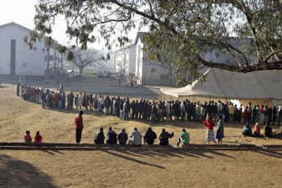 
Residents of Mbare line up to cast their vote in the country's presidential election, at a polling station in Harare, Zimbabwe, Friday.Associated Press
 (Associated Press / The Spokesman-Review)