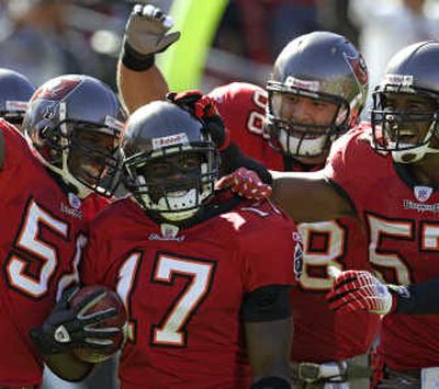 Tampa Bay Buccaneers' wide receiver Micheal Spurlock (17) takes a kick-off  return for a 90-yard touchdown putting his name in the record books as  scoring the first kick-off-return touchdown in the Buccaneers'