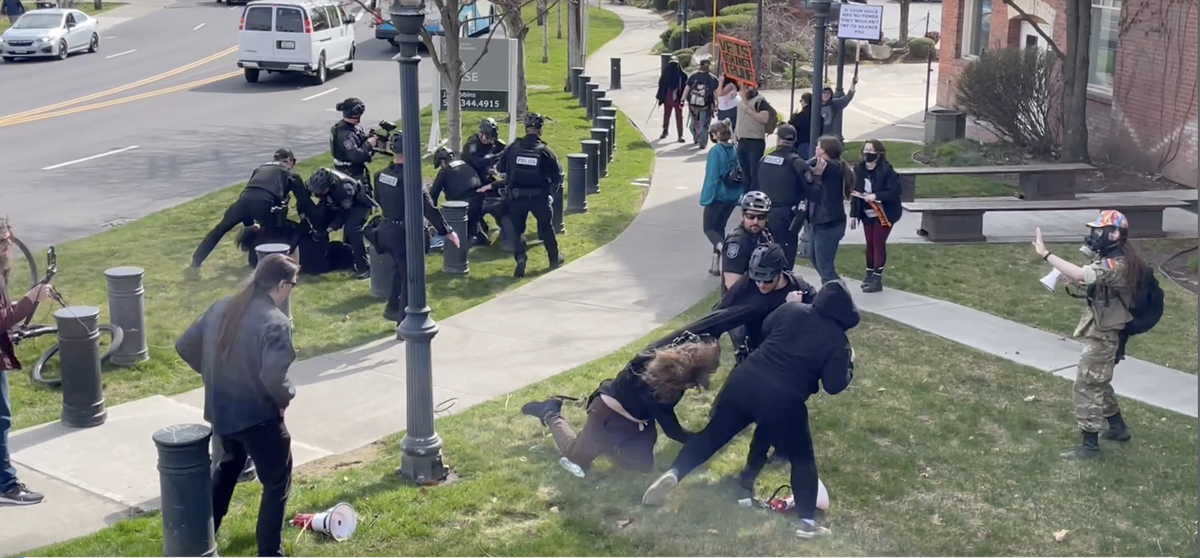 Spokane police and protesters engage in a brief skirmish Saturday outside the U.S. Immigration and Customs Enforcement building near Riverfront Park during a “No Kings” protest against President Donald Trump. Two people were arrested.  (Garrett Cabeza / The Spokesman-Review)
