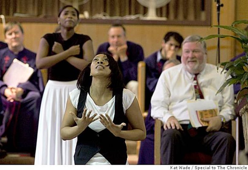 Black, white East Bay churches meld in worship
Aurielle Trapps (arms crossed) and Lisha Bell perform a devotional dance at their church, Imani Community Church, as Piedmont Community Church choir members and their pastor, the Rev. Bill McNabb (right), watch. (Kat Wade / Special to The San Francisco Chronicle) (The Spokesman-Review)