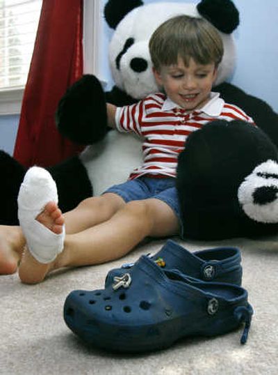 
Rory McDermott's left foot was caught in an escalator last month. The 4-year-old is shown with his Crocs at home in Vienna, Va. Associated Press
 (Associated Press / The Spokesman-Review)