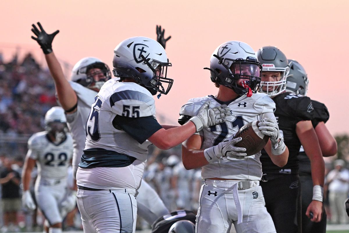 Gonzaga Prep Bullpups Noah Holman (21) scores a touchdown against the Ridgeline Falcons during a football game at Ridgeline High School on Fri. Sept. 6, 2024 in Liberty Lake WA.  (James Snook)