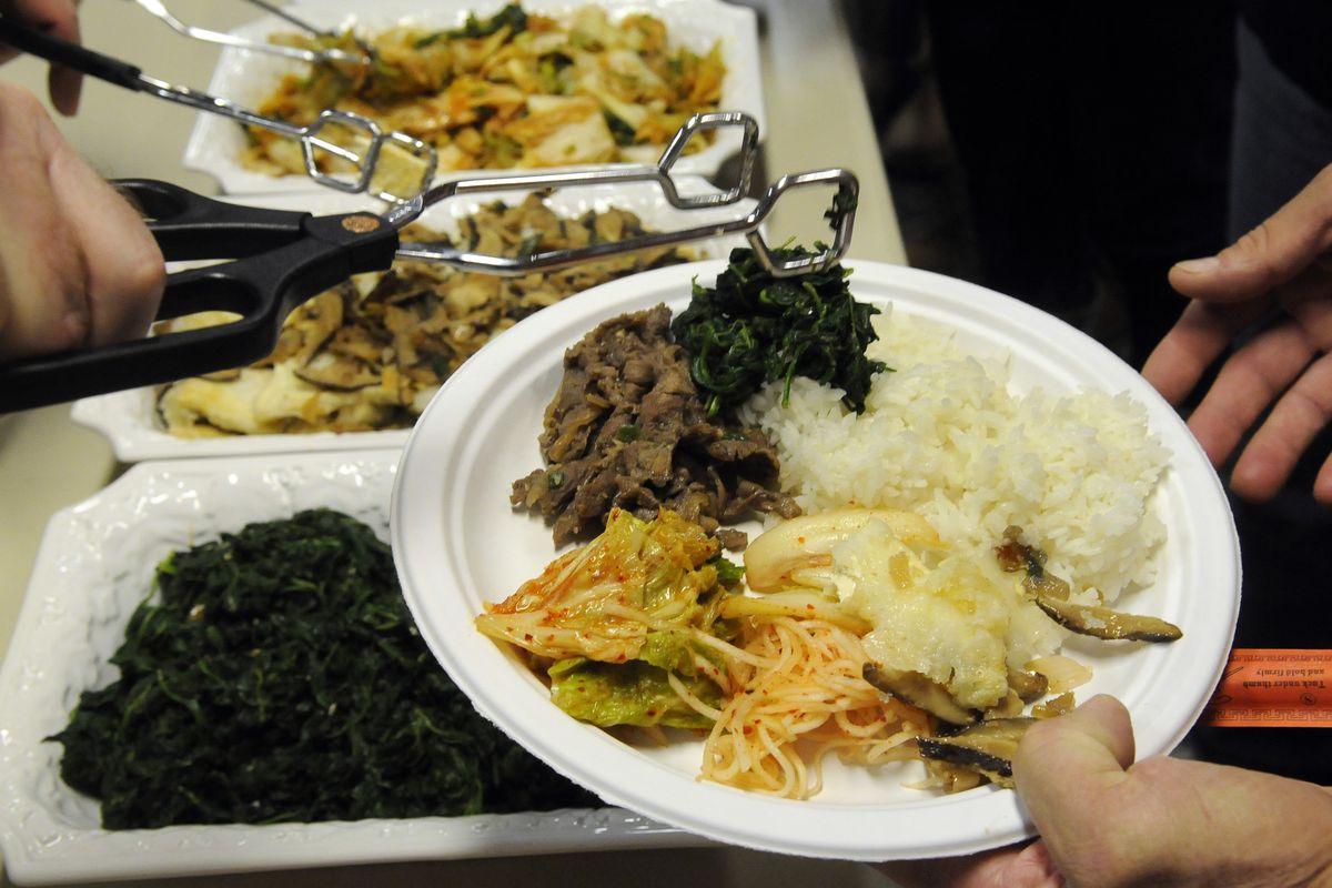A Korean lunch includes; Bulgogi (bbq beef), Shigunchi (spinach salad), and Kimchi (pickled cabbage). (Dan Pelle / The Spokesman-Review)