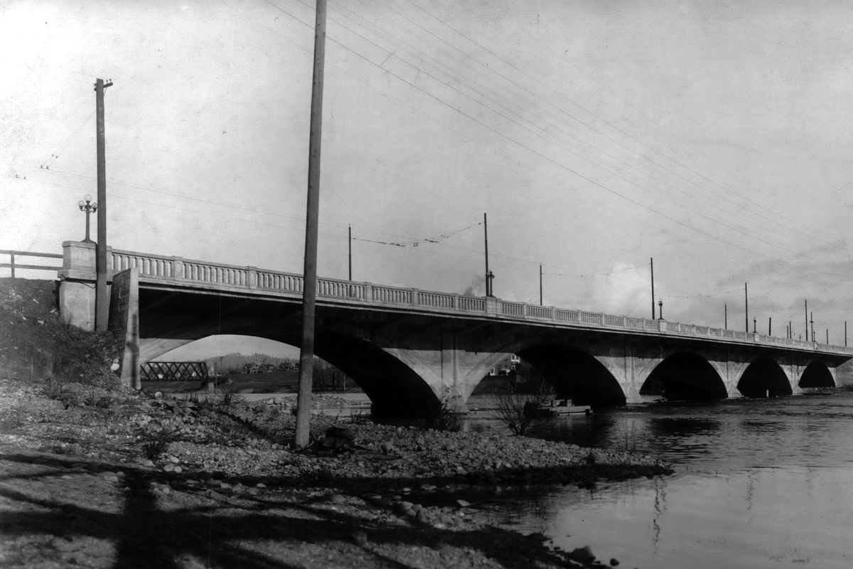 1917 - The 1910 East Olive Bridge is completed and carrying automotive and street car traffic on what would become part of East Trent Avenue. The concrete bridge replaced a rickety wooden bridge and the cost overruns pushed the price well over $100,000. The first 20 years of the 20th century saw more than a dozen new concrete bridges across the Spokane River. (SR)