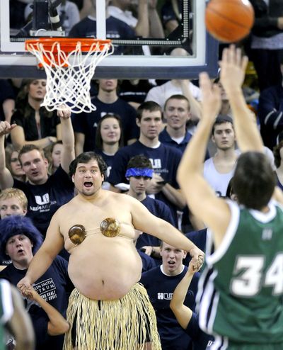 Utah State fan Bill Sproat tries to distract Hawaii center Douglas Kurtz as he shoots a free throw during an NCAA college basketball game Monday, Jan. 11, 2010, in Logan, Utah. (Eli Lucero / The Herald Journal)
