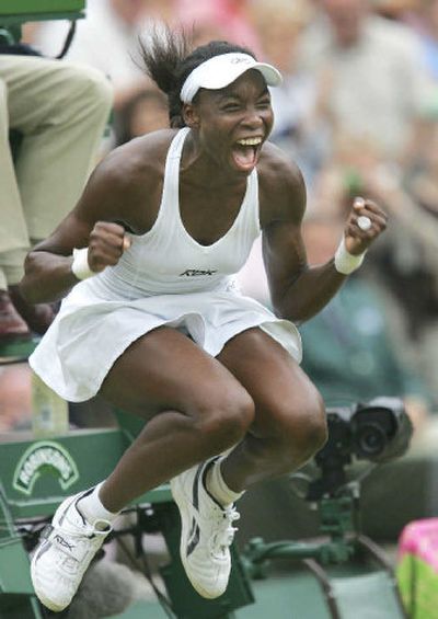 
Venus Williams celebrates her first Grand Slam title in 14 tries after beating fellow American Lindsay Davenport. 
 (Associated Press / The Spokesman-Review)