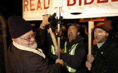 Pro- and anti-death penalty protesters tussle outside of of San Quentin State prison prior to the execution today of Stanley 'Tookie' Williams.
(Associated Press / The Spokesman-Review)