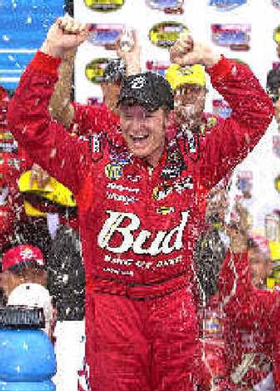 
Dale Earnhardt Jr. celebrates after winning the Checker Auto Parts 500.
 (Associated Press / The Spokesman-Review)