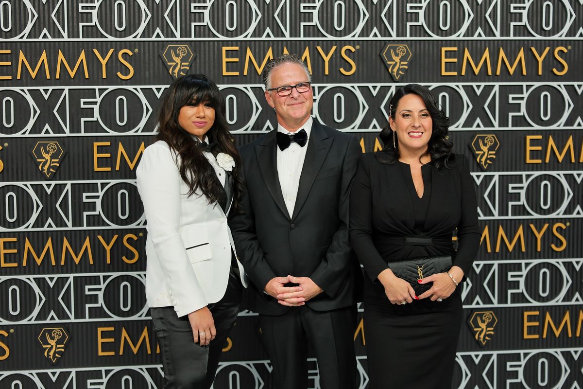 “Daisy Jones & The Six” producer Mandi Price, left, poses on the red carpet with executive producer Brad Mendehlson and his wife Stefanie Schwartz, global head of platform partnerships for Jellysmack, at the 75th Primetime Emmy Awards at Peacock Theater on Jan. 15.  (Getty Images)