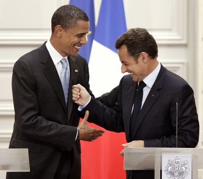 Sen. Barack Obama, D-Ill., left, and French President Nicolas Sarkozy, are seen following their joint press conference after their meeting at the Elysee Palace, in Paris on Friday.  (Associated Press / The Spokesman-Review)