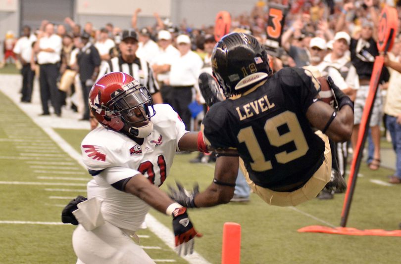 Eastern’s T.J. Lee III shoves Idaho’s Jahrie Level out of end zone to break up a pass. (Associated Press)