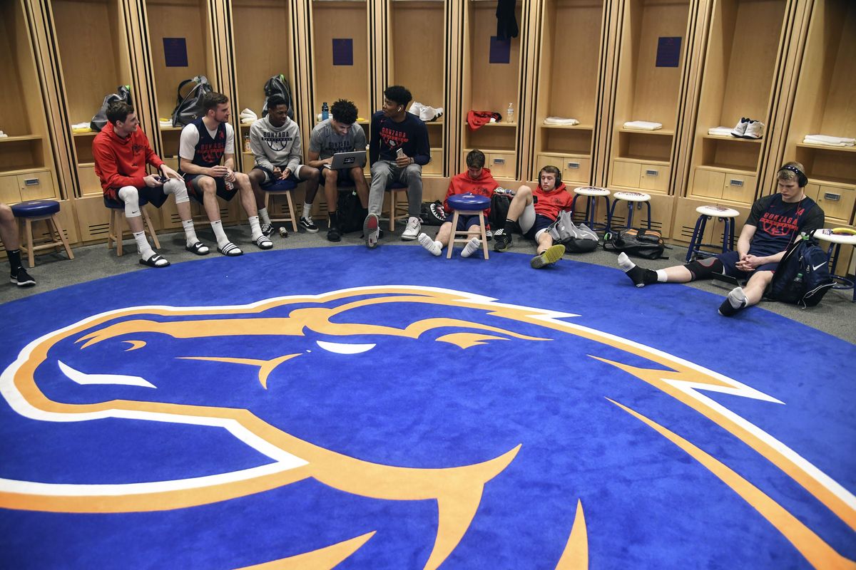 Gonzaga players relax in the Boise State locker room before practicing at Taco Bell Arena in Boise on Wednesday. (Dan Pelle / The Spokesman-Review)