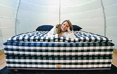 
Mary Pat Wallace, owner of Hastens' Chicago, poses on the Vividus ultra-luxe bed that retails for $49,500.
 (Associated Press / The Spokesman-Review)