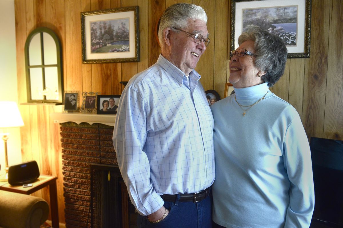 Ollie and Nancy Bowman stand in their Spokane Valley living room on March 12. The two dated in high school and were later engaged, but went on to marry others. After each was widowed, they married in 2010. (Jesse Tinsley)