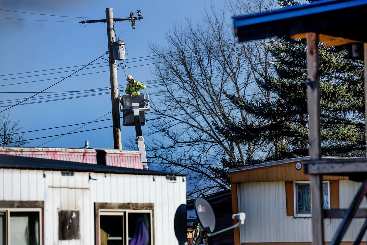 A DePatco Union lineman works to connect homes on the Coeur d’Alene reservation to the internet on Plummer on Tuesday, Dec. 1, 2020. The Coeur d’Alene Tribe has recieved grants funded through the Idaho Department of Commerce funded by the CARES Act congress passed in March.  (Kathy Plonka/The Spokesman-Review)