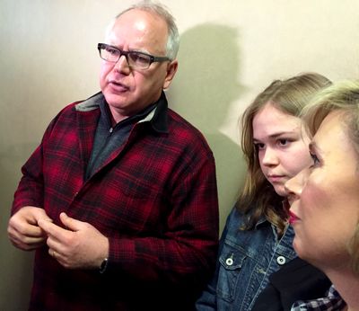 U.S. Rep. Tim Walz speaks to reporters after filing campaign finance paperwork for his 2018 gubernatorial campaign on Monday, March 27, 2017. Walz's daughter Hope and wife Gwen look on.   (David Montgomery / Pioneer Press)