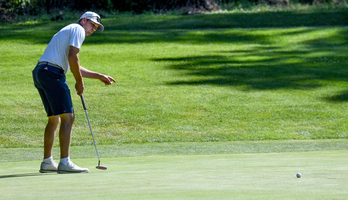 Daniel Campbell directs his birdie putt into the cup on No. 17 Sunday at the Rosauers Open Invitational.  (Kathy Plonka/The Spokesman-Review)