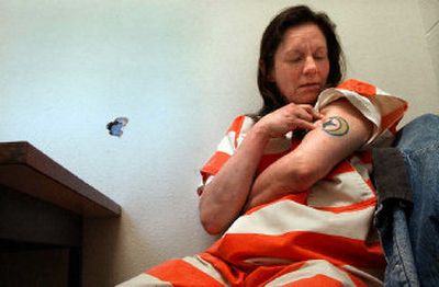
Sherrin Larson talks about her tattoo Thursday while doing time at Geiger Corrections Center for drug possession. She got the tattoo years ago after several weeks of being straight. Larson''s life consists of jail time and time on the streets doing drugs. 
 (Brian Plonka / The Spokesman-Review)
