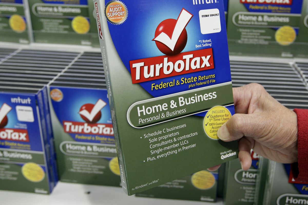 A customer looks at a copy of TurboTax on sale at Costco in Mountain View, Calif.