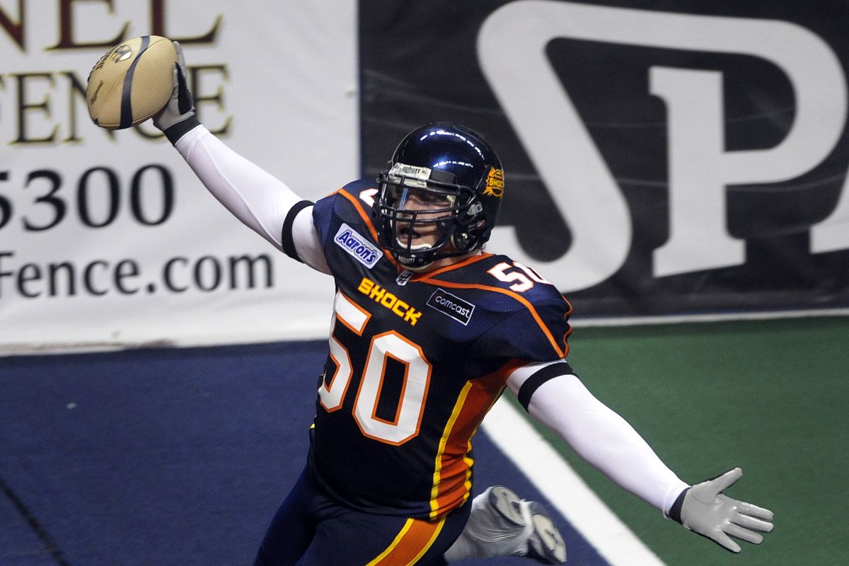 Shock linebacker Kevin McCullough soaks in the cheers after scoring on an interception late in the first half April 3, 2009, against Stockton. The Shock won. (Colin Mulvany / The Spokesman-Review)