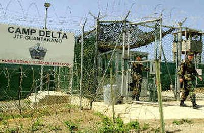 
Soldiers walk past Camp Delta at the Guantanamo Bay Naval Base in Cuba.
 (File/Associated Press / The Spokesman-Review)