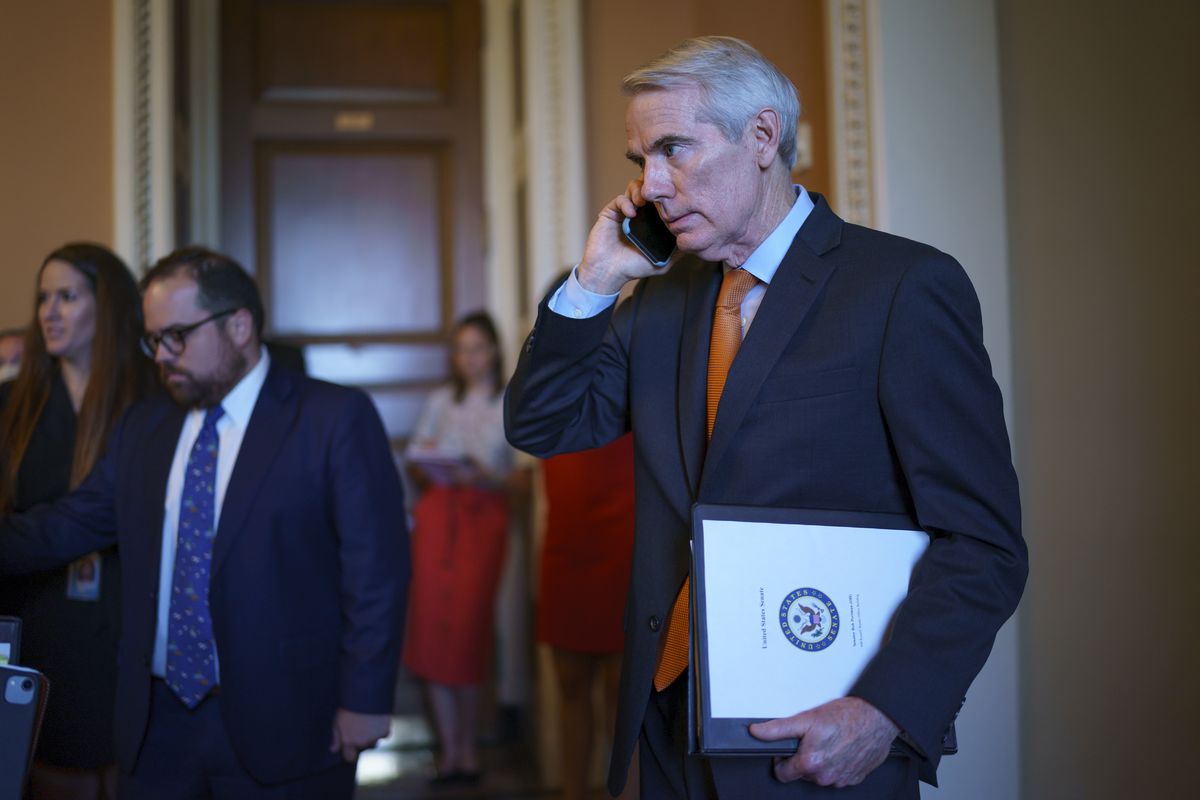 Sen. Rob Portman, R-Ohio, the lead GOP negotiator on the infrastructure talks, emerges from the office of Senate Republican leader Mitch McConnell to announce he has reached a $1 trillion infrastructure bill with Democrats and is ready to vote to take up the bill, at the Capitol in Washington, Wednesday, July 28, 2021.  (J. Scott Applewhite)